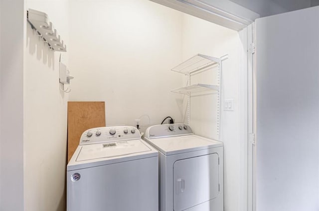 730 Ruthven, Houston, TX 77019 - clothes washing area with separate washer and dryer