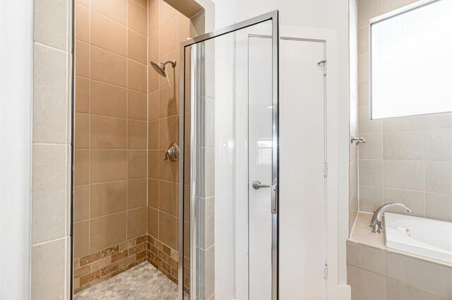730 Ruthven, Houston, TX 77019 - bathroom featuring a stall shower and a bath