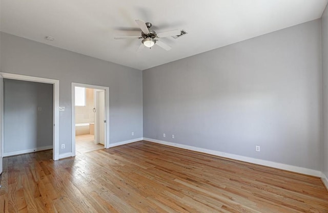 730 Ruthven, Houston, TX 77019 - unfurnished bedroom with light wood-style flooring, baseboards, ensuite bath, and a ceiling fan