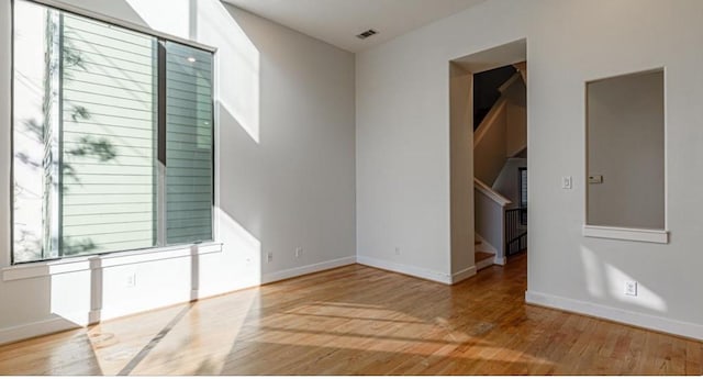 730 Ruthven, Houston, TX 77019 - spare room featuring wood finished floors, baseboards, and stairs