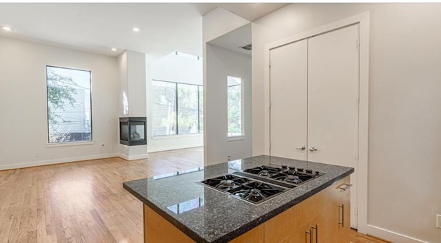 730 Ruthven, Houston, TX 77019 - kitchen with black gas cooktop, healthy amount of natural light, light wood-type flooring, and recessed lighting
