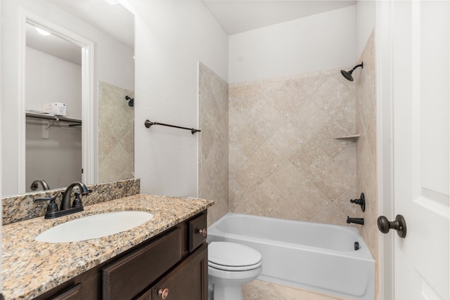 bathroom featuring bathtub / shower combination, toilet, and vanity