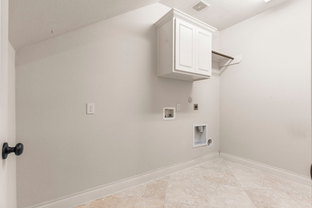 clothes washing area with hookup for an electric dryer, hookup for a gas dryer, baseboards, cabinet space, and washer hookup