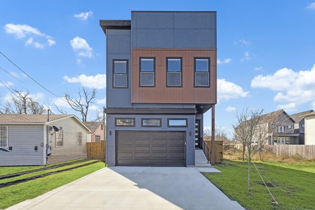 830 E 40th St, Houston, TX 77022 - view of front of property featuring concrete driveway, a garage, and a residential view