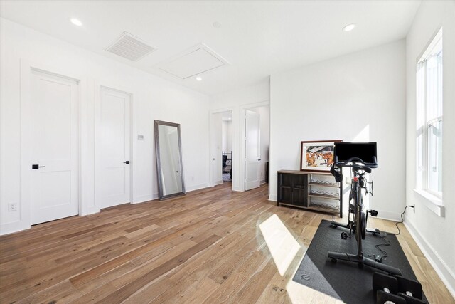 830 E 40th St, Houston, TX 77022 - workout area featuring attic access, light wood-style flooring, healthy amount of natural light, baseboards, and recessed lighting