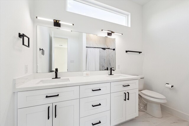 830 E 40th St, Houston, TX 77022 - bathroom with marble finish floors, toilet, baseboards, a shower with shower curtain, and double vanity