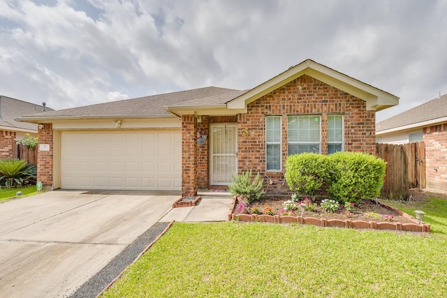 2707 Trementina Dr, Houston, TX 77088 - view of front of home with brick siding, an attached garage, and driveway