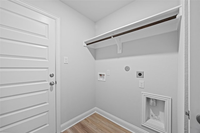 20068 Swinley Forest Dr, Cleveland, TX 77327 - washroom with hookup for an electric dryer, light wood-type flooring, hookup for a washing machine, baseboards, and hookup for a gas dryer