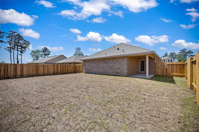 20068 Swinley Forest Dr, Cleveland, TX 77327 - back of property with brick siding and a patio area