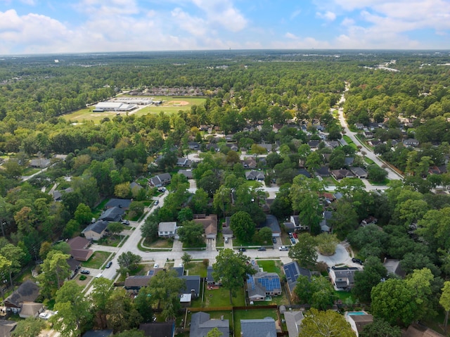aerial perspective of suburban area with a heavily wooded area