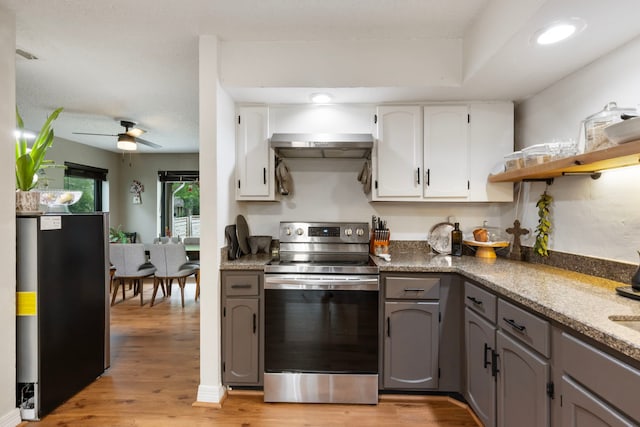 kitchen featuring stainless steel appliances, light wood finished floors, gray cabinetry, white cabinets, and recessed lighting