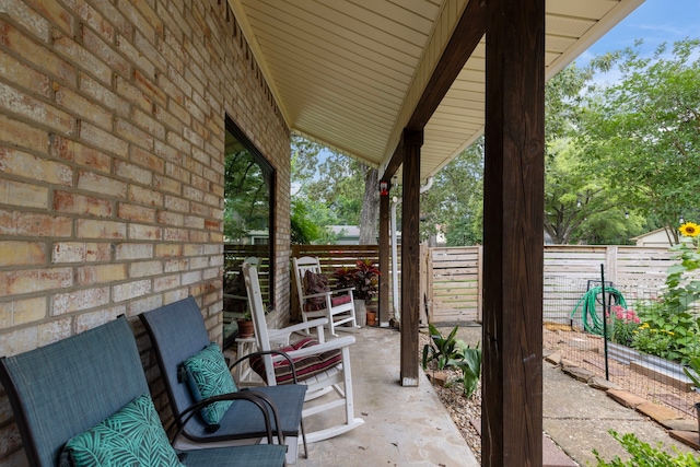view of patio / terrace featuring fence