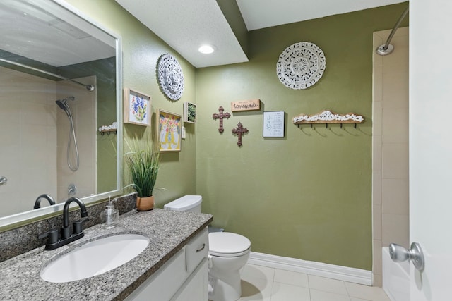 full bathroom featuring a shower, tile patterned floors, toilet, and baseboards