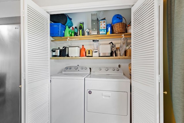 laundry room with washer and clothes dryer