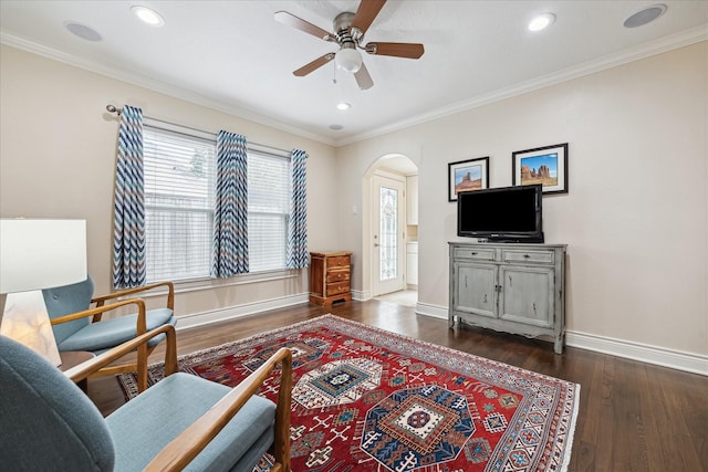 6026 Lake St, West University Place, TX 77005 - living area with arched walkways, a ceiling fan, dark wood-type flooring, baseboards, and crown molding