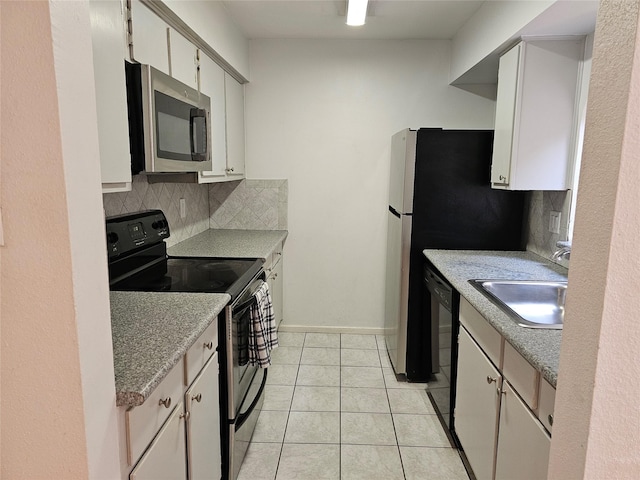 1100 Augusta Dr Unit 42, Houston, TX 77057 - kitchen with stainless steel microwave, electric range oven, a sink, and decorative backsplash