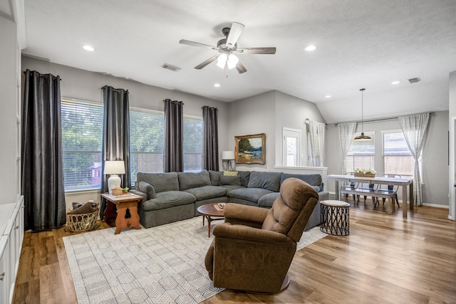 living room with ceiling fan, wood finished floors, vaulted ceiling, and recessed lighting