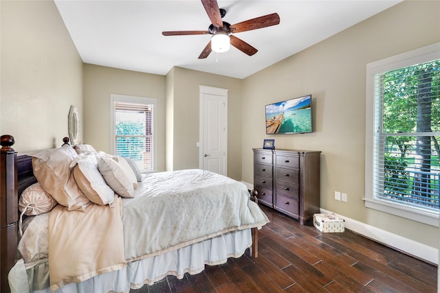 5523 Harvest Oak Landing Dr, Spring, TX 77386 - bedroom featuring dark wood finished floors, baseboards, and a ceiling fan