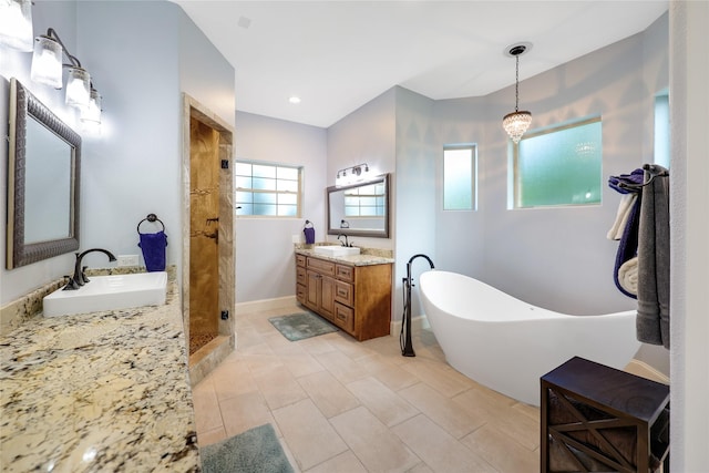 5523 Harvest Oak Landing Dr, Spring, TX 77386 - full bath with a tile shower, a soaking tub, two vanities, and tile patterned floors