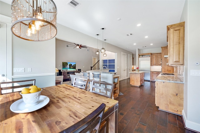 5523 Harvest Oak Landing Dr, Spring, TX 77386 - dining area featuring dark wood finished floors, stairway, recessed lighting, a ceiling fan, and a chandelier