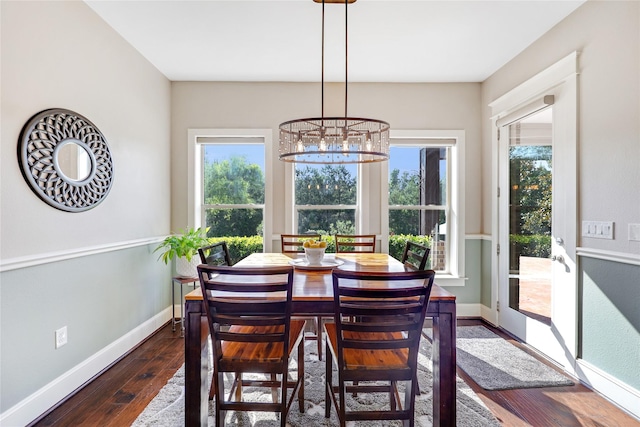5523 Harvest Oak Landing Dr, Spring, TX 77386 - dining space featuring a chandelier, dark wood-type flooring, and baseboards