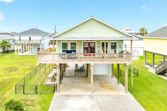 4126 Grayson Dr, Galveston, TX 77554 - back of house with a garage and concrete driveway
