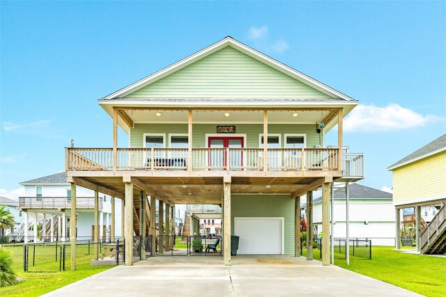 4126 Grayson Dr, Galveston, TX 77554 - coastal inspired home featuring a carport, a garage, stairway, and a gate