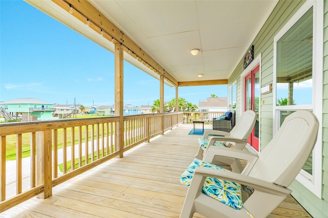 4126 Grayson Dr, Galveston, TX 77554 - wooden terrace featuring a residential view and a porch
