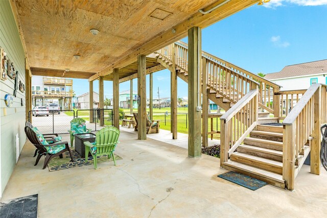 4126 Grayson Dr, Galveston, TX 77554 - view of patio / terrace with stairs, fence, and a residential view