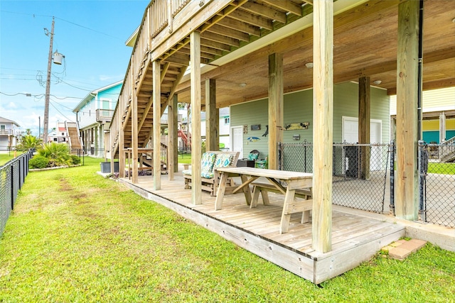 4126 Grayson Dr, Galveston, TX 77554 - back of property featuring a deck, stairs, and outdoor dining area