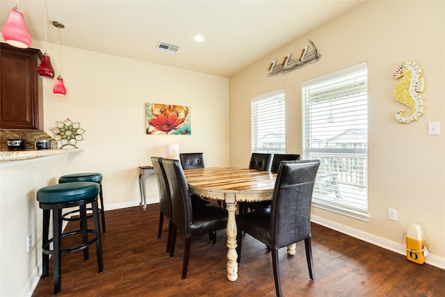 4126 Grayson Dr, Galveston, TX 77554 - dining room featuring plenty of natural light, dark wood-style floors, baseboards, and recessed lighting