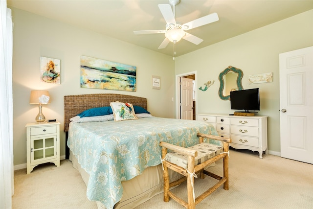 4126 Grayson Dr, Galveston, TX 77554 - bedroom with light carpet, baseboards, and a ceiling fan