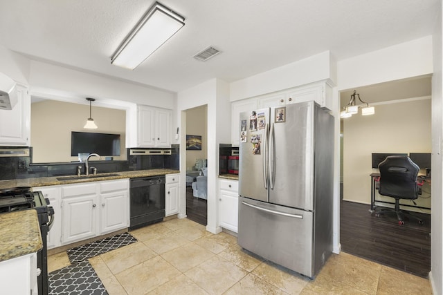 17310 Chaseloch St, Spring, TX 77379 - kitchen featuring black appliances, a sink, white cabinetry, and tasteful backsplash