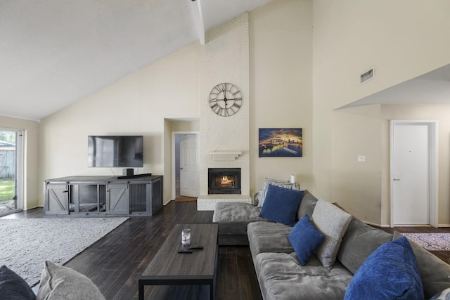 17310 Chaseloch St, Spring, TX 77379 - living area with high vaulted ceiling, a brick fireplace, and wood finished floors