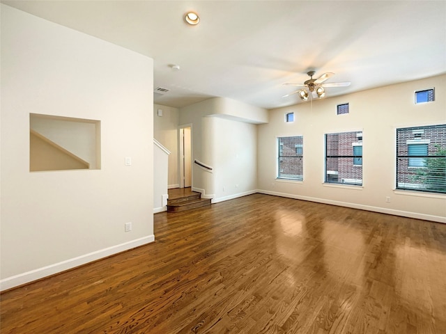 3701 Main Plaza Dr, Houston, TX 77025 - unfurnished living room featuring ceiling fan, baseboards, stairs, dark wood finished floors, and recessed lighting