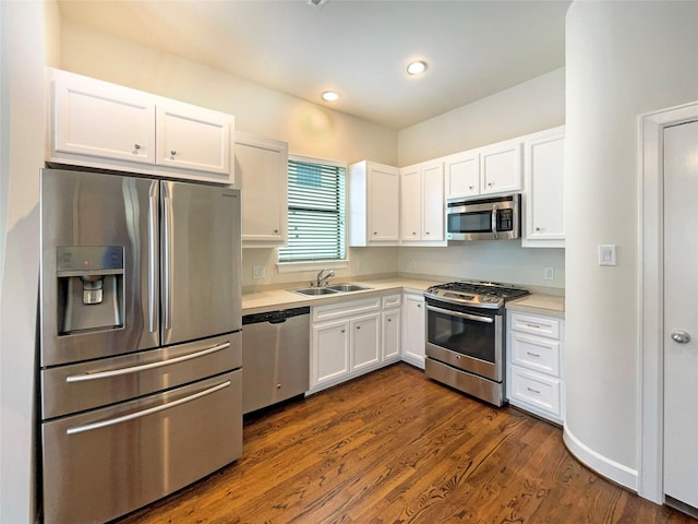 3701 Main Plaza Dr, Houston, TX 77025 - kitchen with stainless steel appliances, a sink, light countertops, white cabinetry, and recessed lighting