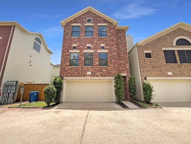 3701 Main Plaza Dr, Houston, TX 77025 - view of front facade featuring driveway, a garage, and brick siding