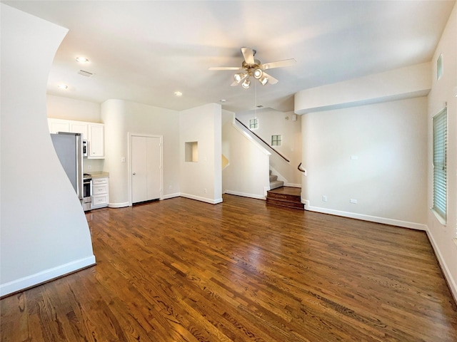 3701 Main Plaza Dr, Houston, TX 77025 - unfurnished living room with a ceiling fan, dark wood-type flooring, stairs, baseboards, and recessed lighting