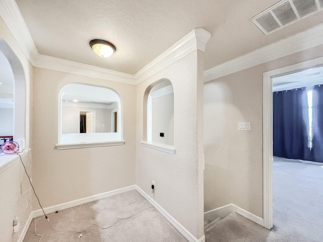 5715 Ladonia St, Arcola, TX 77583 - hall with carpet flooring, ornamental molding, baseboards, and arched walkways