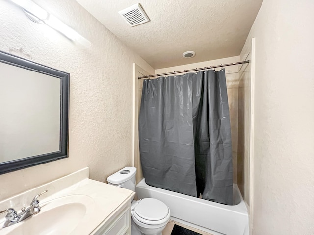5715 Ladonia St, Arcola, TX 77583 - bathroom with a textured wall, a textured ceiling, shower / tub combo with curtain, vanity, and toilet