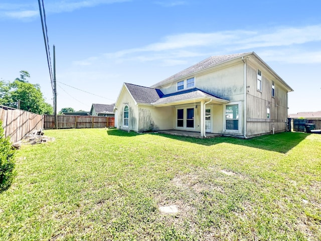 5715 Ladonia St, Arcola, TX 77583 - rear view of house featuring stucco siding