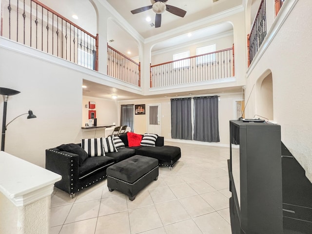 5715 Ladonia St, Arcola, TX 77583 - tiled living area featuring crown molding, a towering ceiling, and ceiling fan