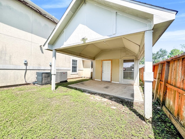 5715 Ladonia St, Arcola, TX 77583 - back of property featuring cooling unit, a patio, and stucco siding
