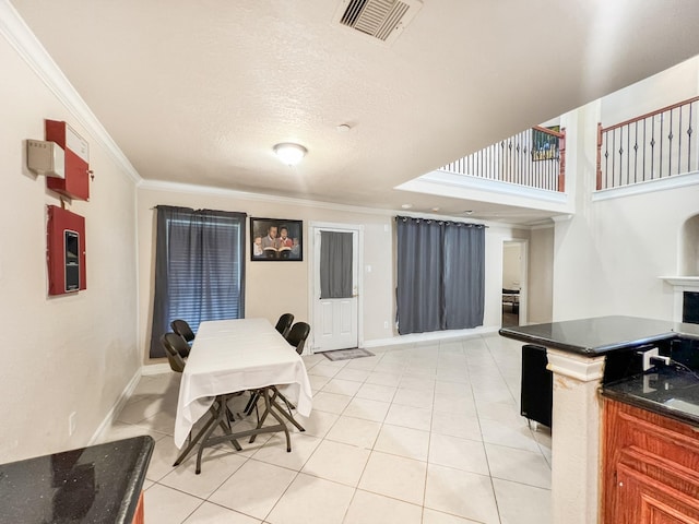 5715 Ladonia St, Arcola, TX 77583 - dining space featuring ornamental molding, light tile patterned flooring, and baseboards