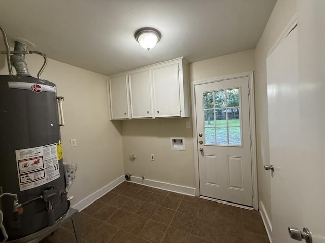 washroom with gas water heater, baseboards, washer hookup, and cabinet space