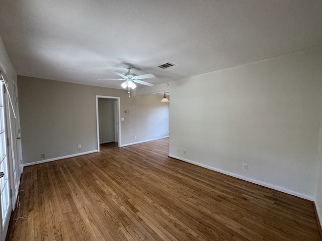 216 Gale St, Houston, TX 77009 - unfurnished room featuring a ceiling fan, wood finished floors, and baseboards