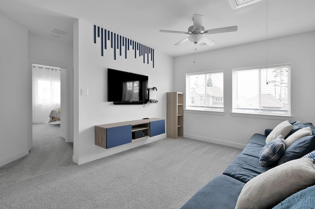 2807 Kingly Pine Trl, Conroe, TX 77385 - living room with light colored carpet, attic access, a ceiling fan, and baseboards