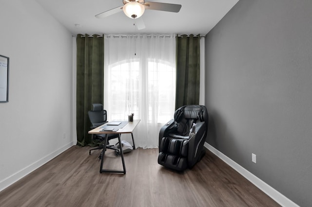 2807 Kingly Pine Trl, Conroe, TX 77385 - sitting room featuring an office area, ceiling fan, wood finished floors, and baseboards