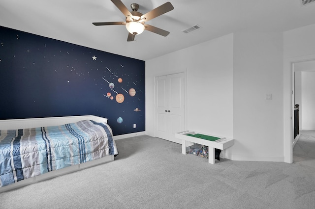 2807 Kingly Pine Trl, Conroe, TX 77385 - carpeted bedroom with baseboards, ceiling fan, and a closet