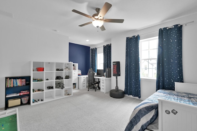 2807 Kingly Pine Trl, Conroe, TX 77385 - carpeted bedroom featuring multiple windows, a desk, and ceiling fan